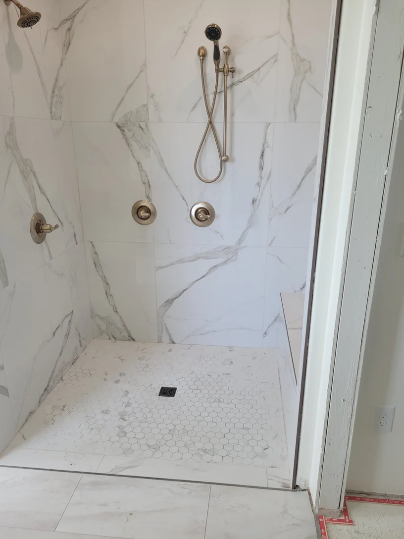 White marble bathroom tile installation