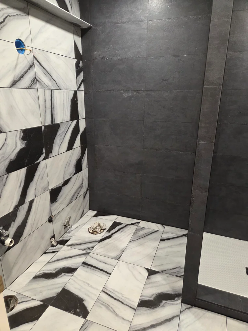 Dark modern shower tile remodel